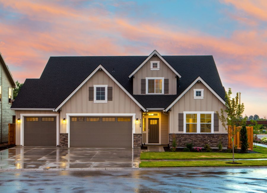 brown-and-gray-painted-house-in-front-of-road-1396122